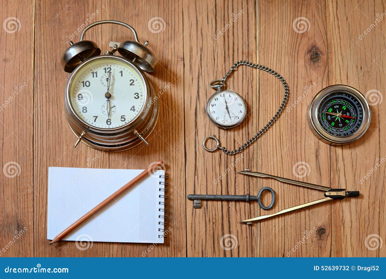 Alarm Clock, Pocket Watch and a Compass Stock Photo Image of
