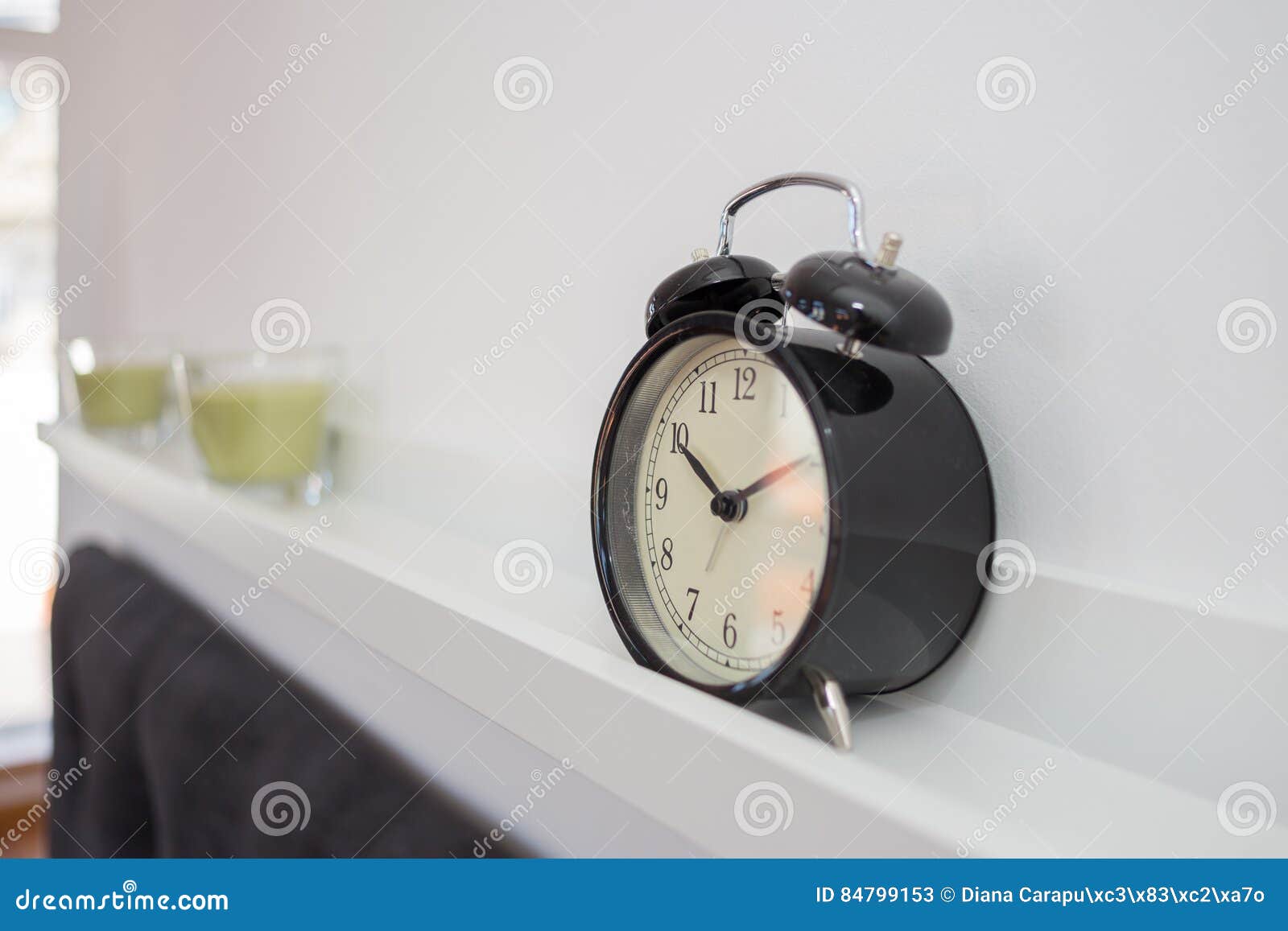 alarm clock on a shelve
