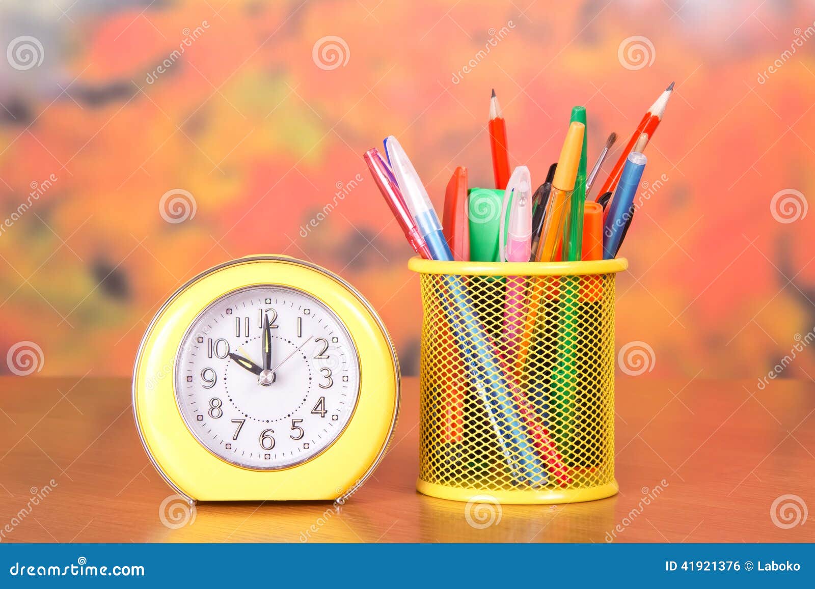 Alarm Clock, Stand with Pencils and Handles Stock Photo Image of pink