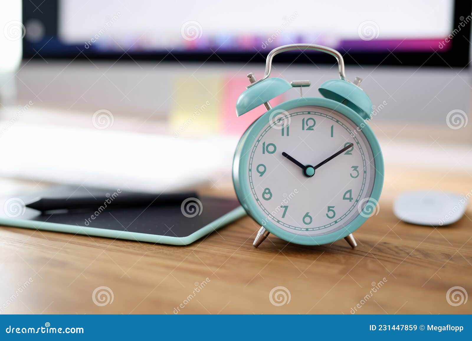 Alarm Clock for Ten in Morning is on Desktop in Office Stock Image