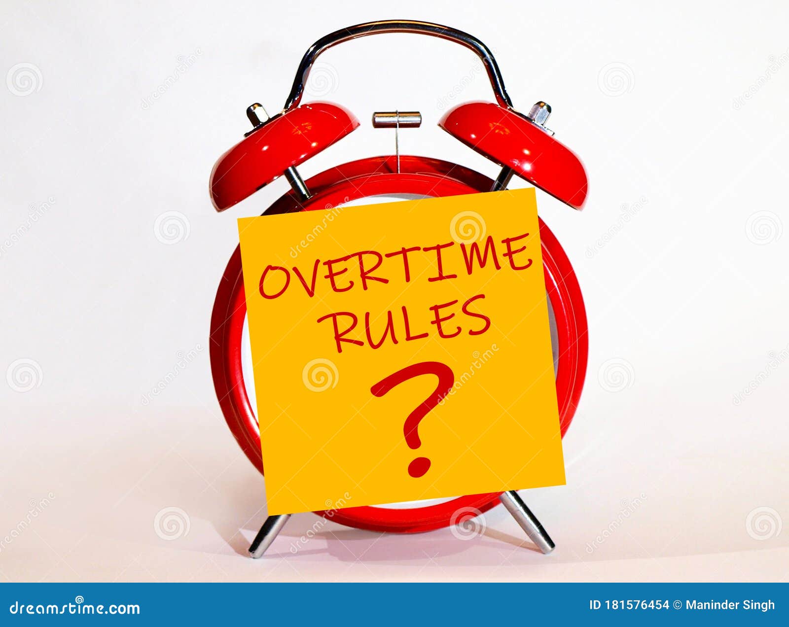 an alarm clock and a yellow note with text overtime rules?