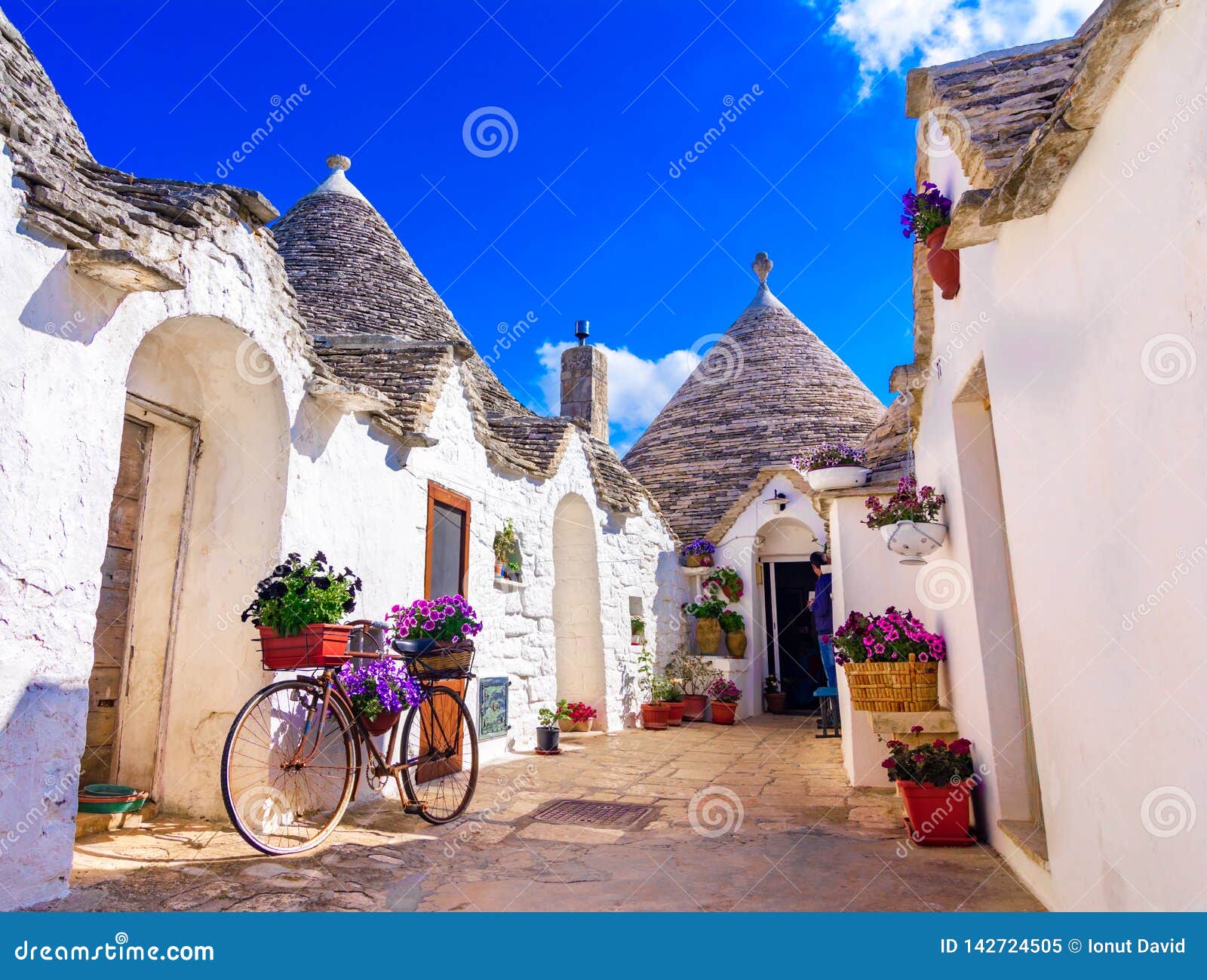 alberobello, puglia, italy: typical houses built with dry stone walls and conical roofs