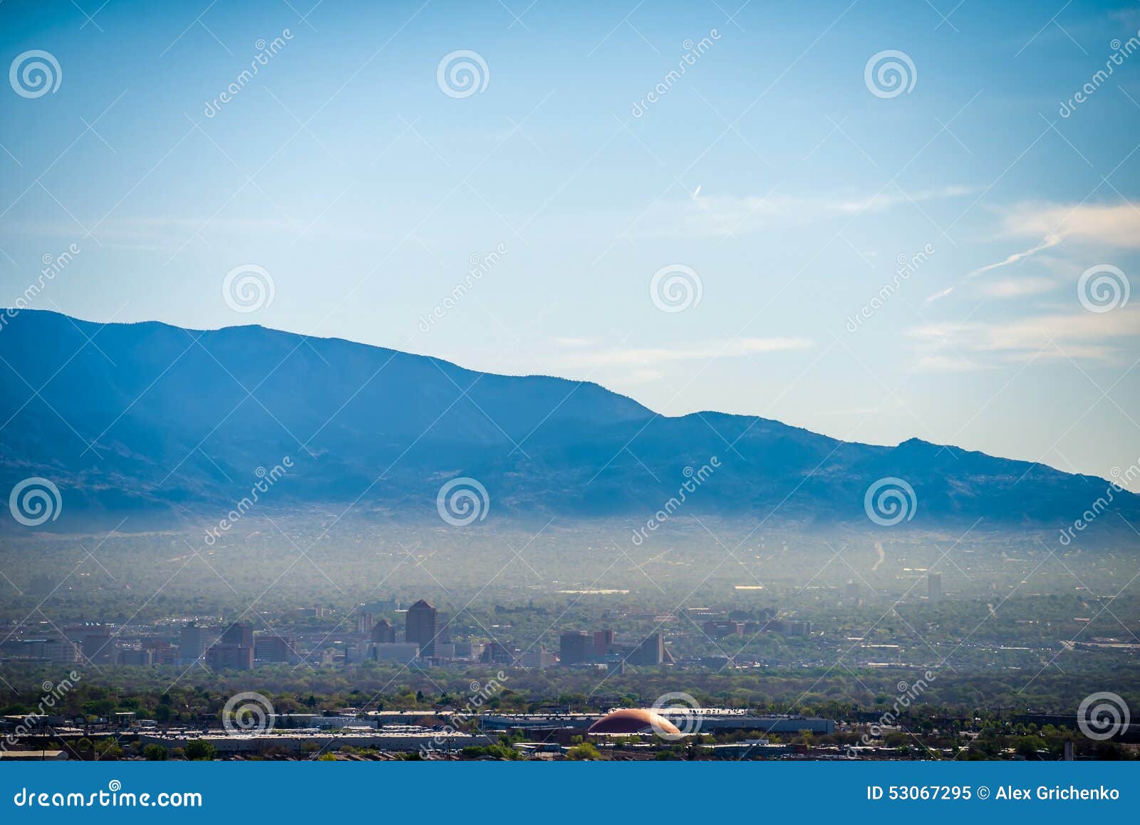 albuquerque new mexico skyline in smog with mountains