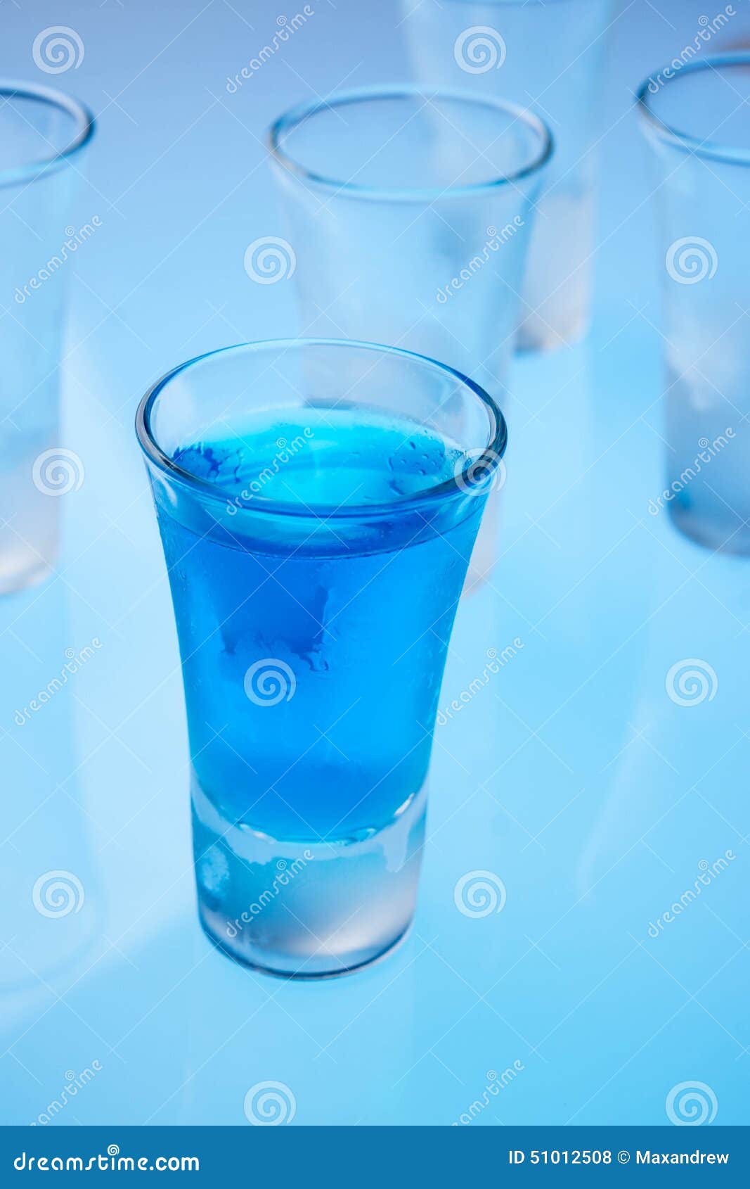 Alcohol in shot glasses stock photo. Image of blue, closeup 51012508