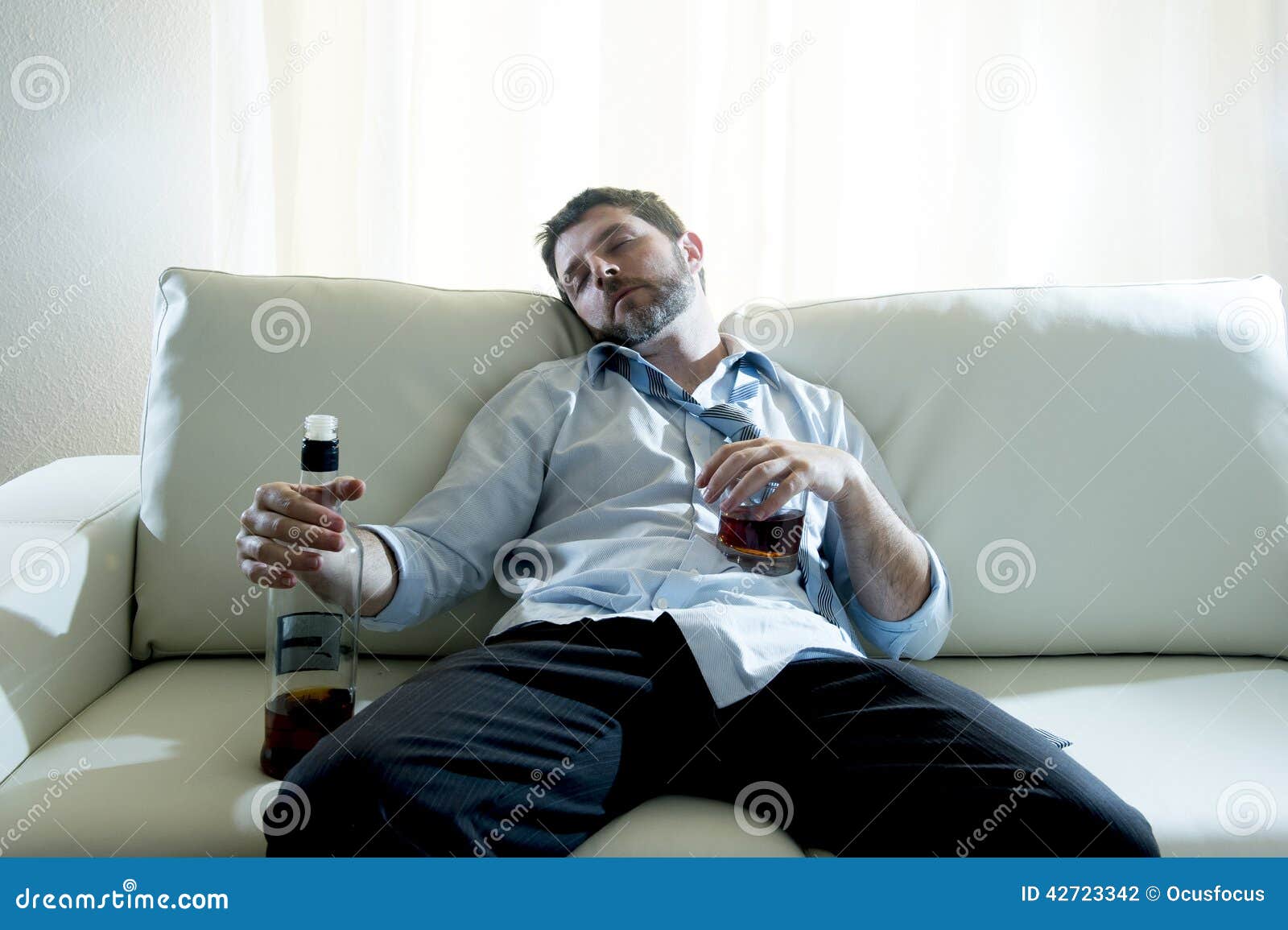 Alcoholic Business Man Wearing Blue Loose Tie Drunk with Whiskey Bottle ...