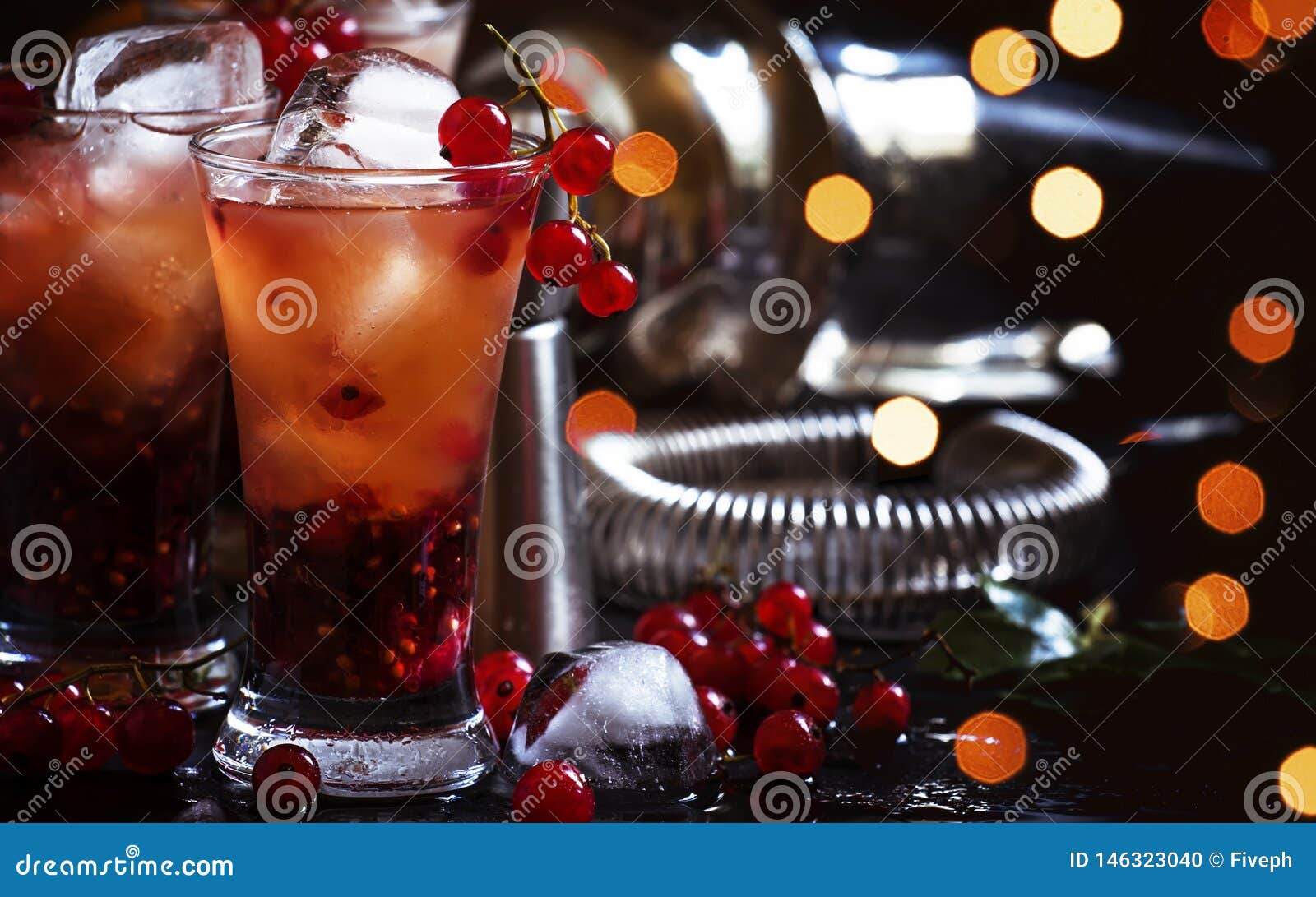 Alcoholic Cocktail with Liqueur, Orange Juice and Red Currant, Black