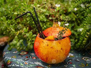Alcoholic Cocktail Poured Inside Pomegranate Pomegranate Is Used As A 