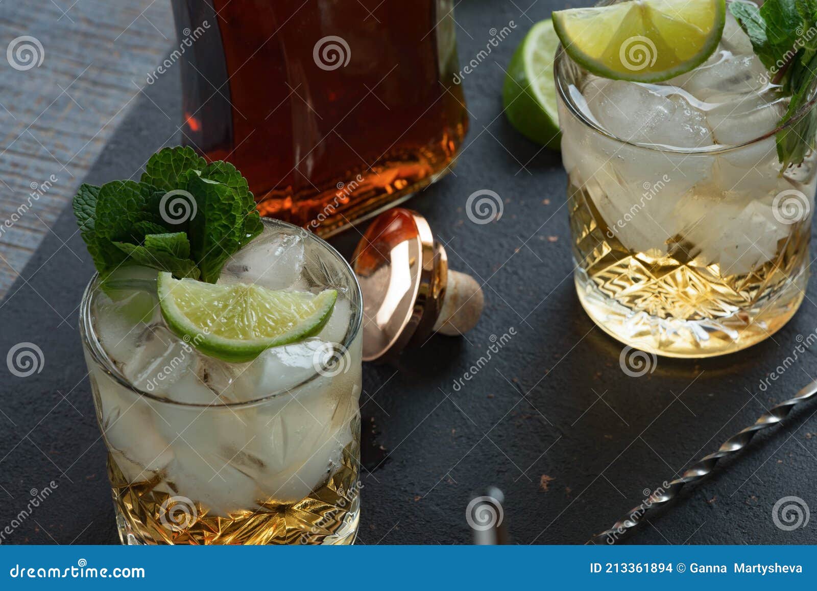 Alcoholic Cocktail with Rum and Ice and Mint on a Dark Background in a