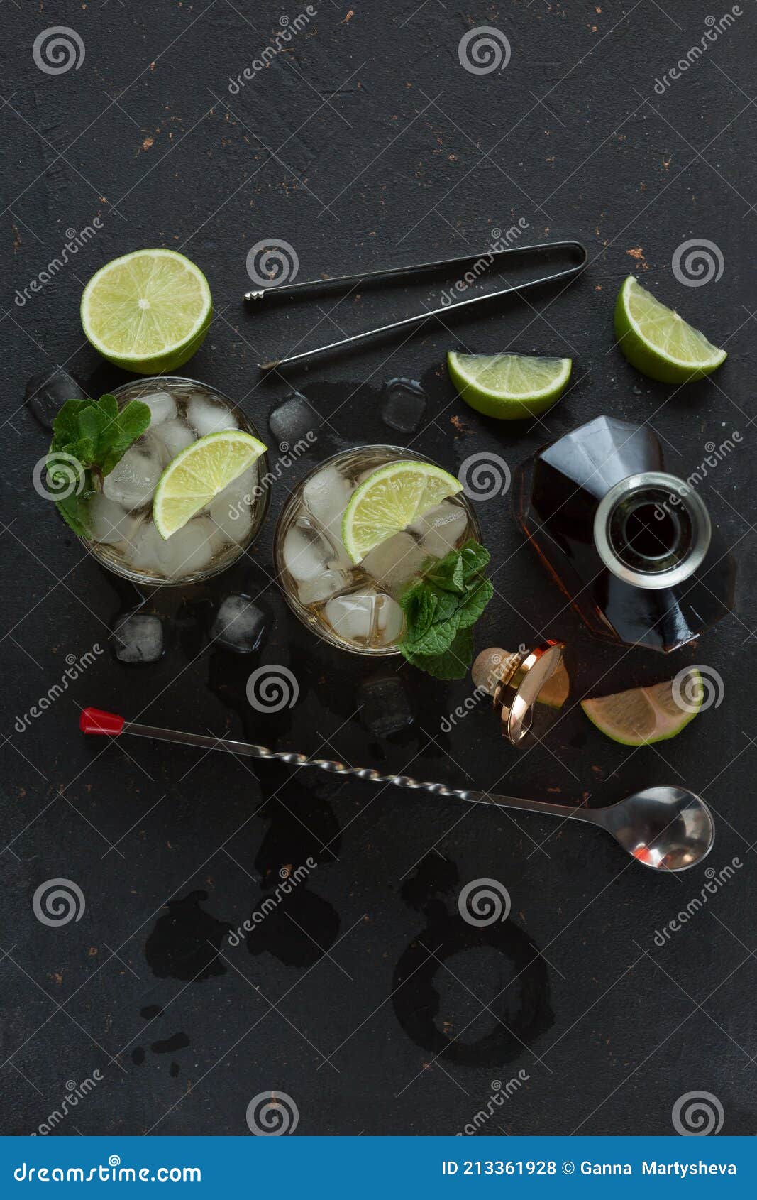 Alcoholic Cocktail with Rum and Ice and Mint on a Dark Background in a