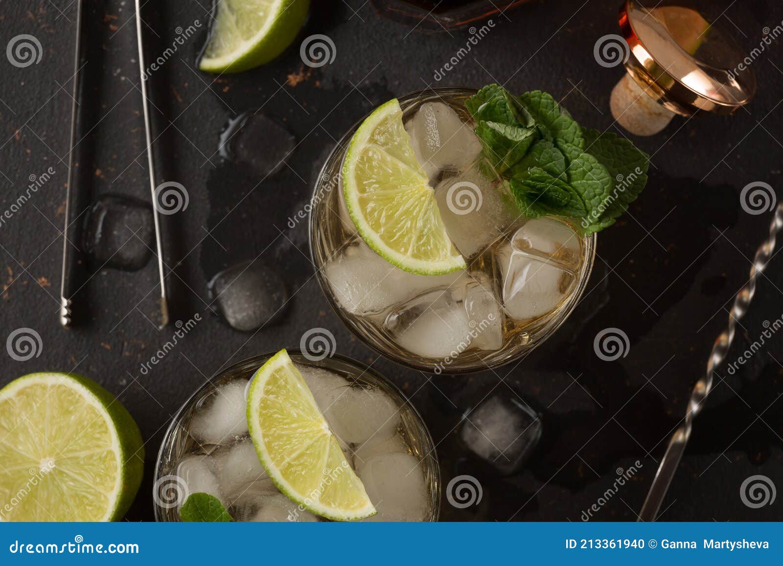 Alcoholic Cocktail with Rum and Ice and Mint on a Dark Background in a