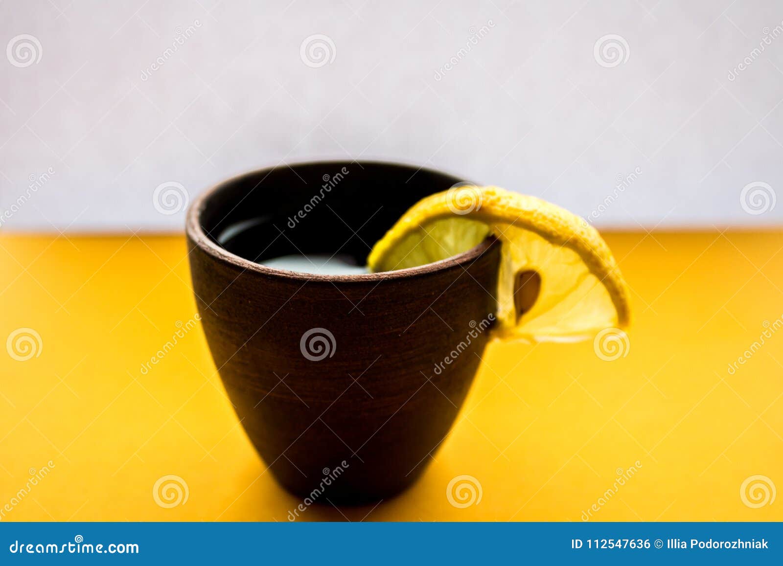 Alcoholic drink with lemon stock photo. Image of lemon 112547636
