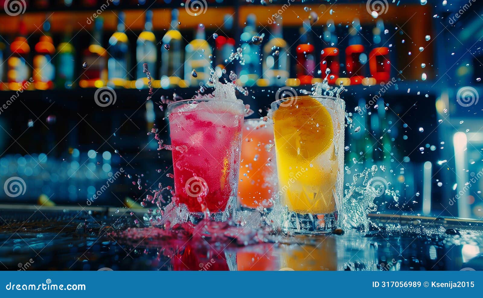 alcoholic drinks. juicy fruit cocktail is poured into a glass with splashes