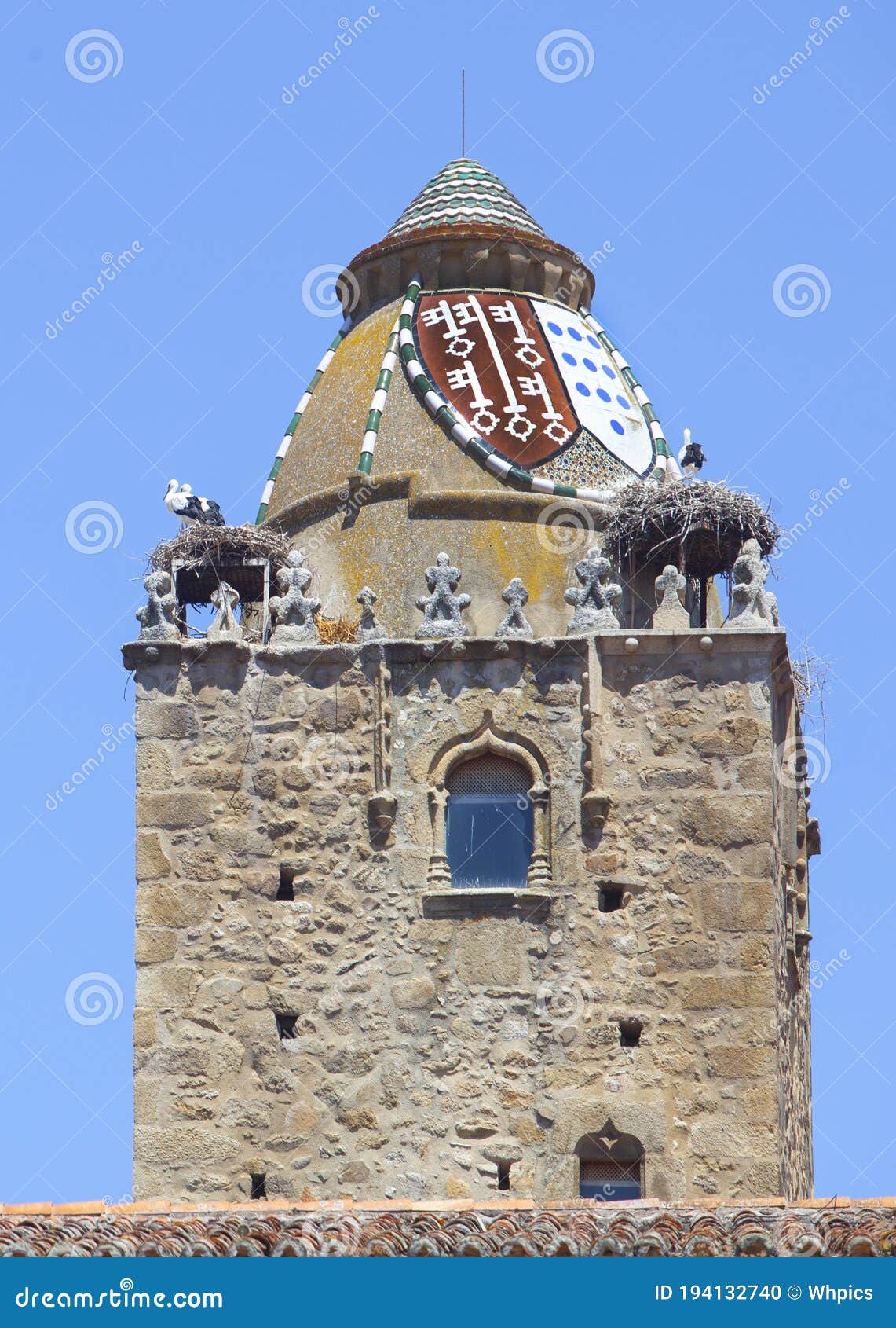 alfiler tower, gothic belfry adorned with glazed roof tiles, trujillo, spain