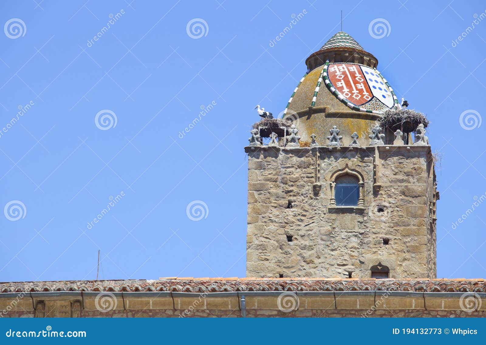 alfiler tower, gothic belfry adorned with glazed roof tiles, trujillo, spain