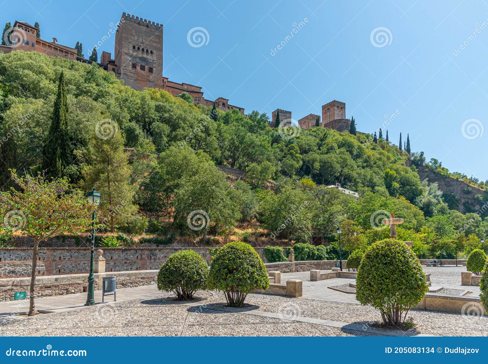 alhambra palace viewed from paseo de los tristes in granada, spain