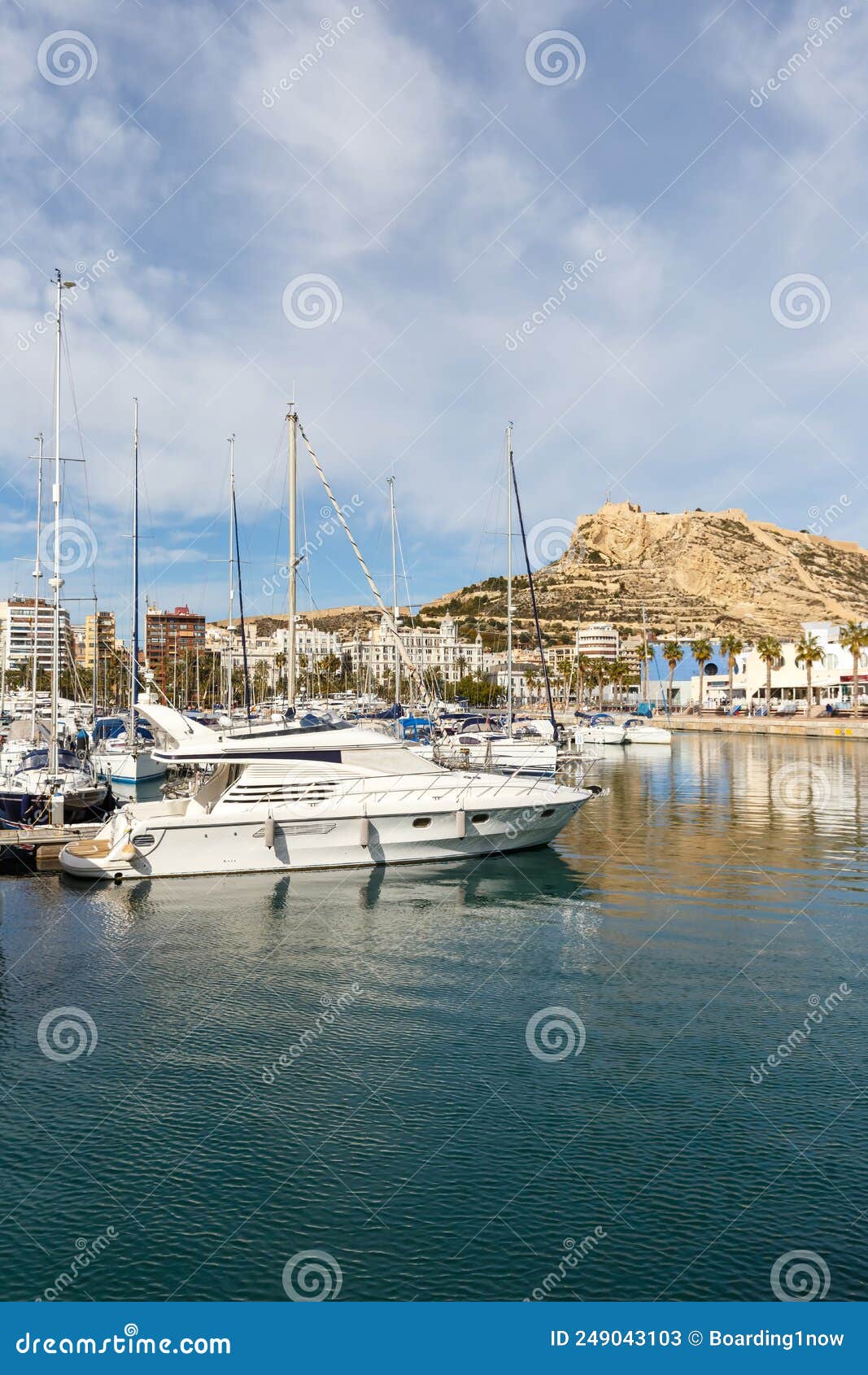 alicante port d`alacant marina with boats and view of castle castillo travel traveling holidays vacation portrait format in spain