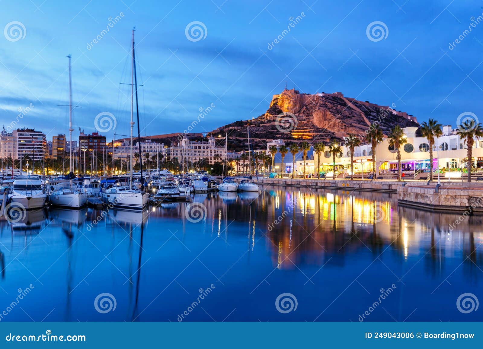 alicante port d`alacant marina with boats and view of castle castillo twilight travel traveling holidays vacation in spain