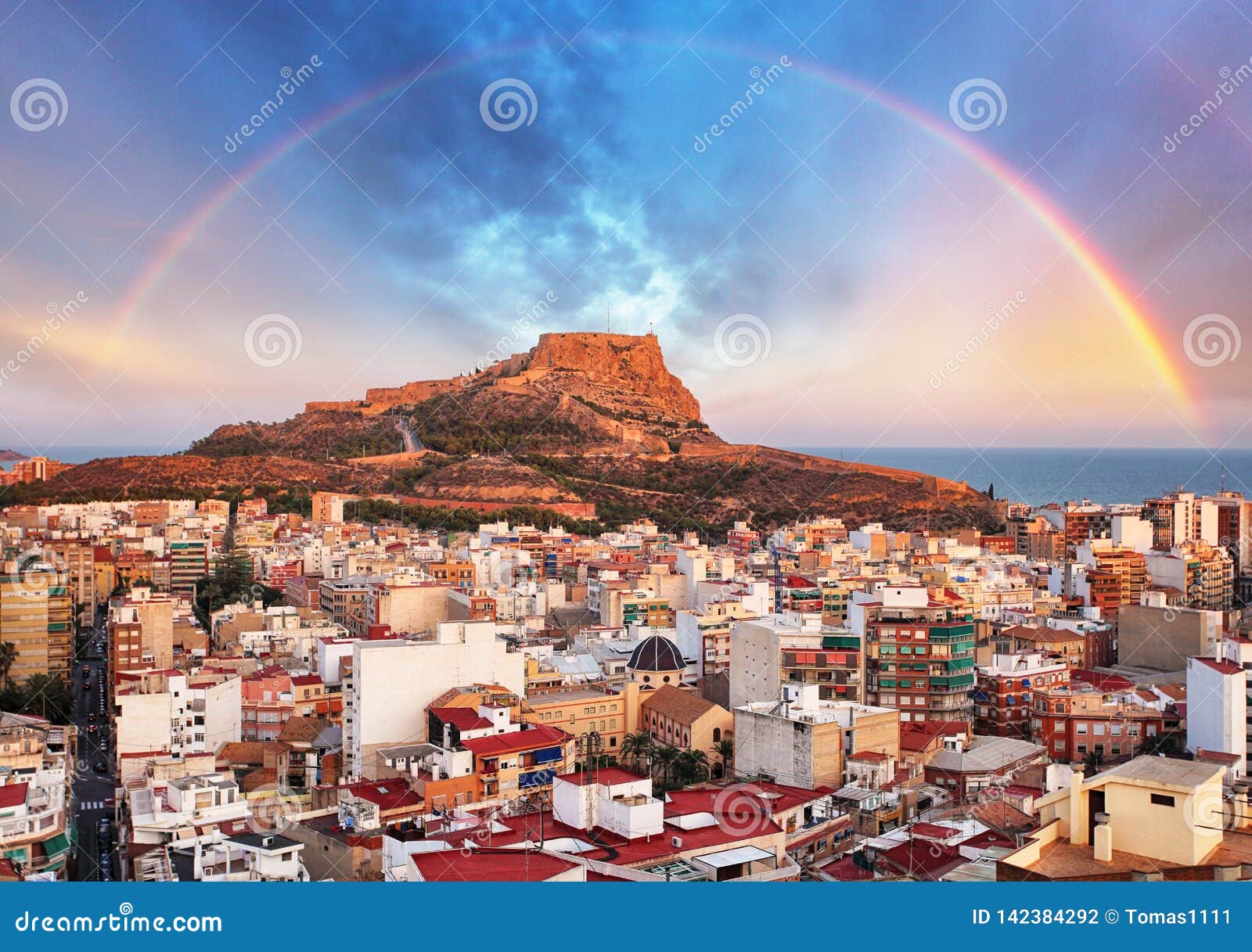 alicante in spain at sunset with rainbow