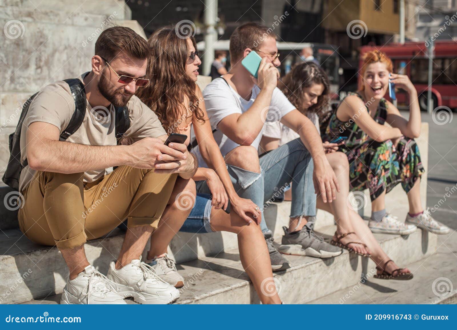 group of friends using smartphones. emotional isolation and technology depresion