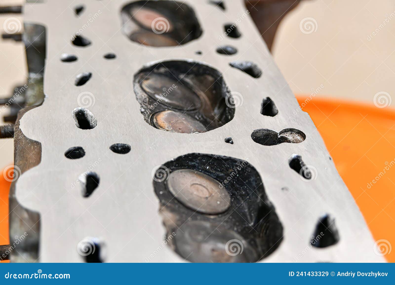 Aligned and Ground Cylinder Head with an Abrasive Stone on a Surface