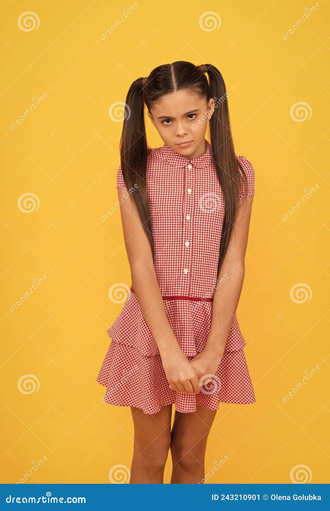 all the taste of being a girl. shy girl in dress yellow background. girlhood and childhood