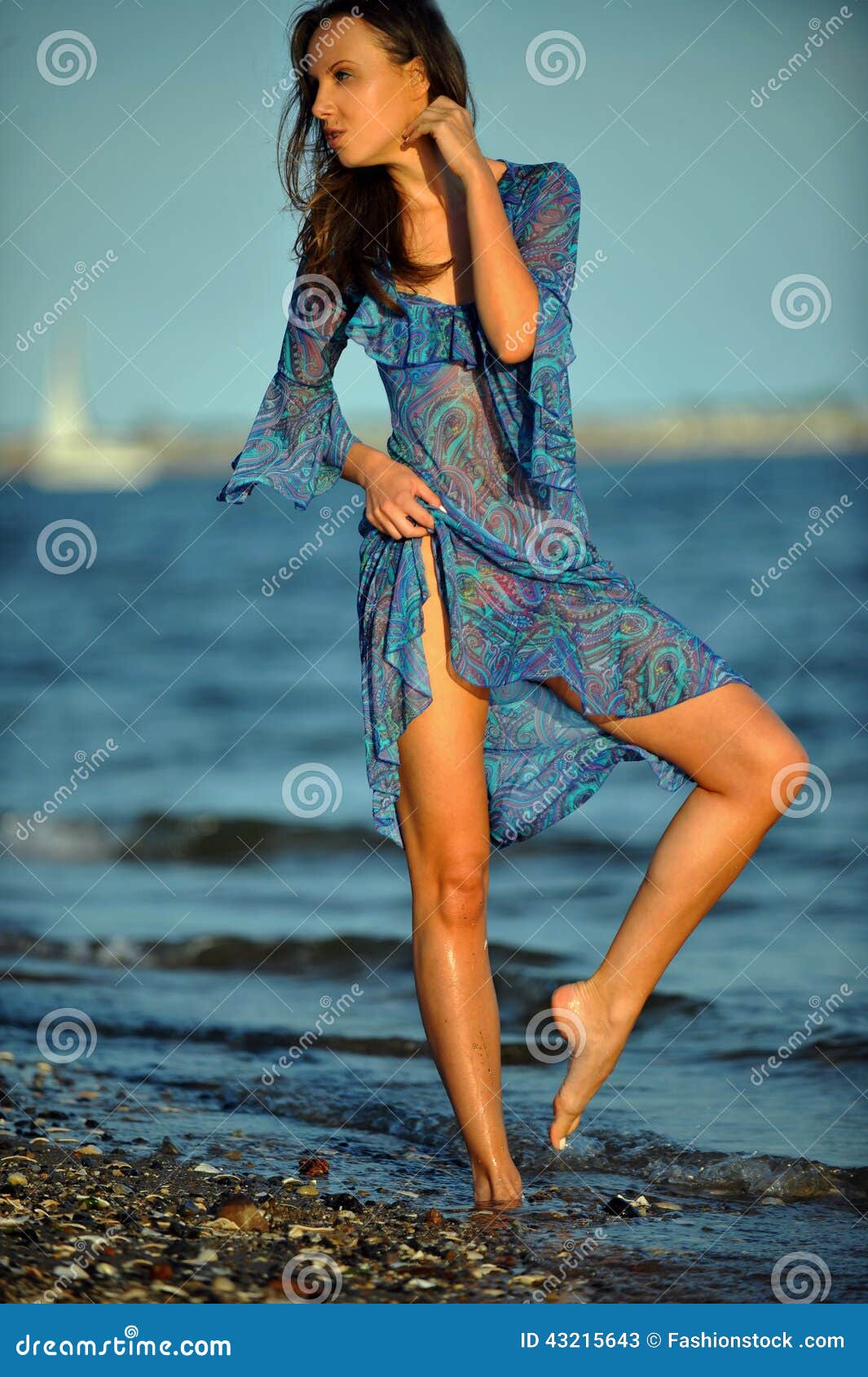 Alluring Woman Posing On The Beach In Floral Transparent Dress Stock Photo Image