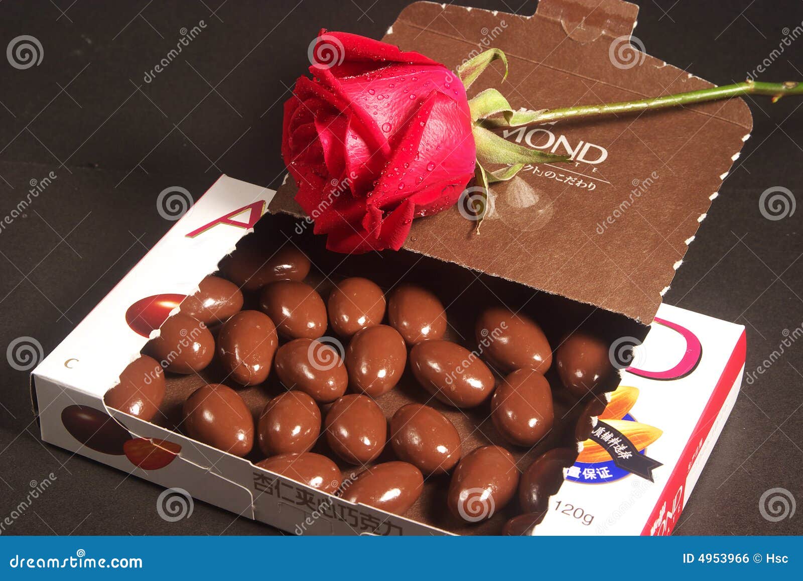 Almond chocolates and rose stock photo. Image of calorie 4953966