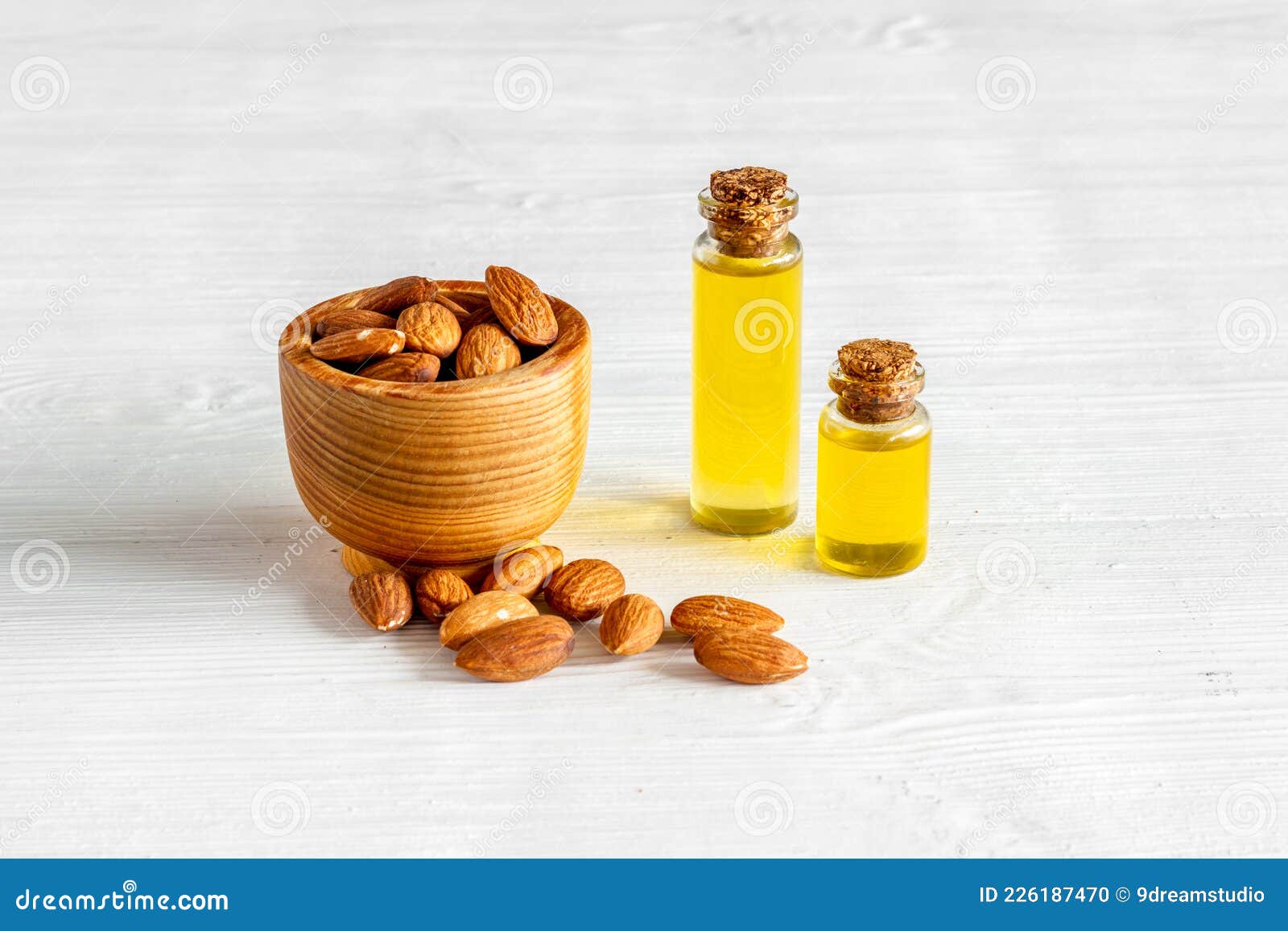 Almond Oil in Bottle with Almond Nuts. Extra Virgin Essence Oil Stock