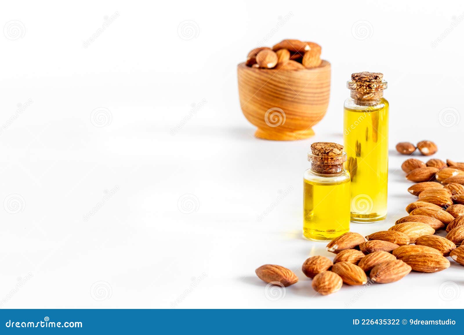Almond Oil in Bottle with Almond Nuts. Extra Virgin Essence Oil Stock