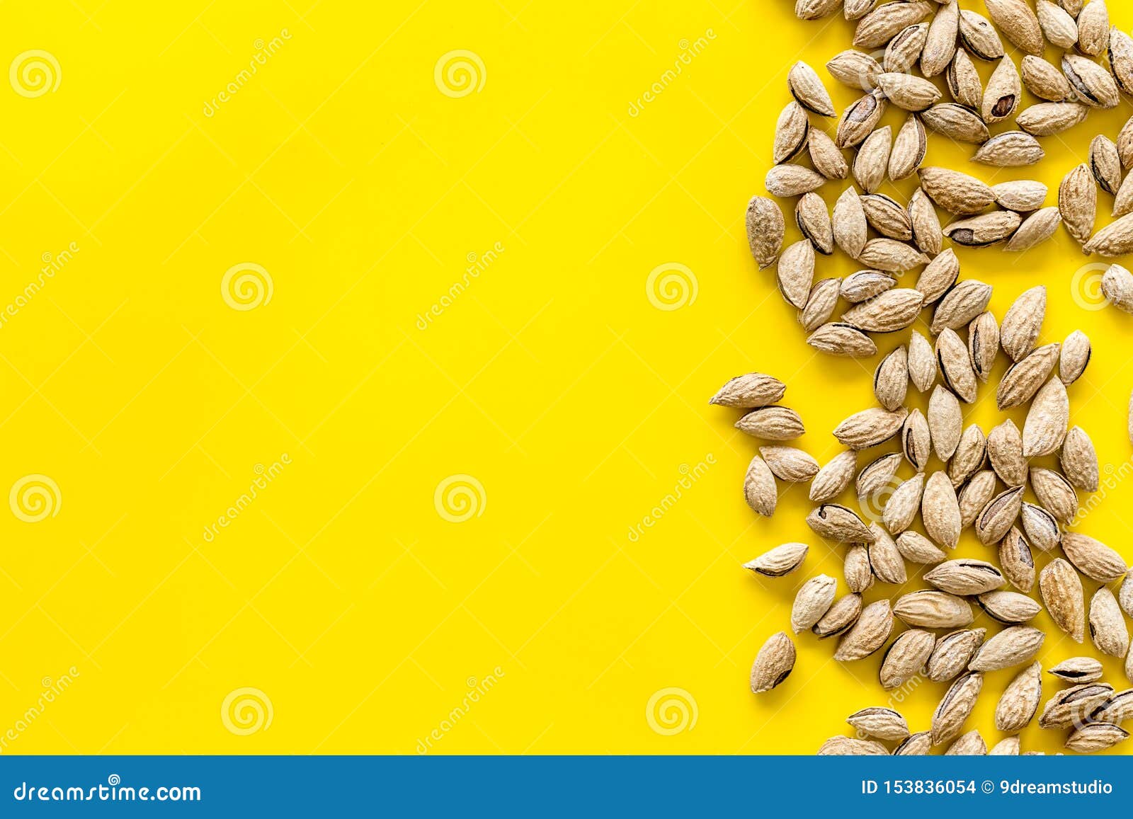 Almond on Yellow Background Top View Space for Text Stock Photo - Image ...