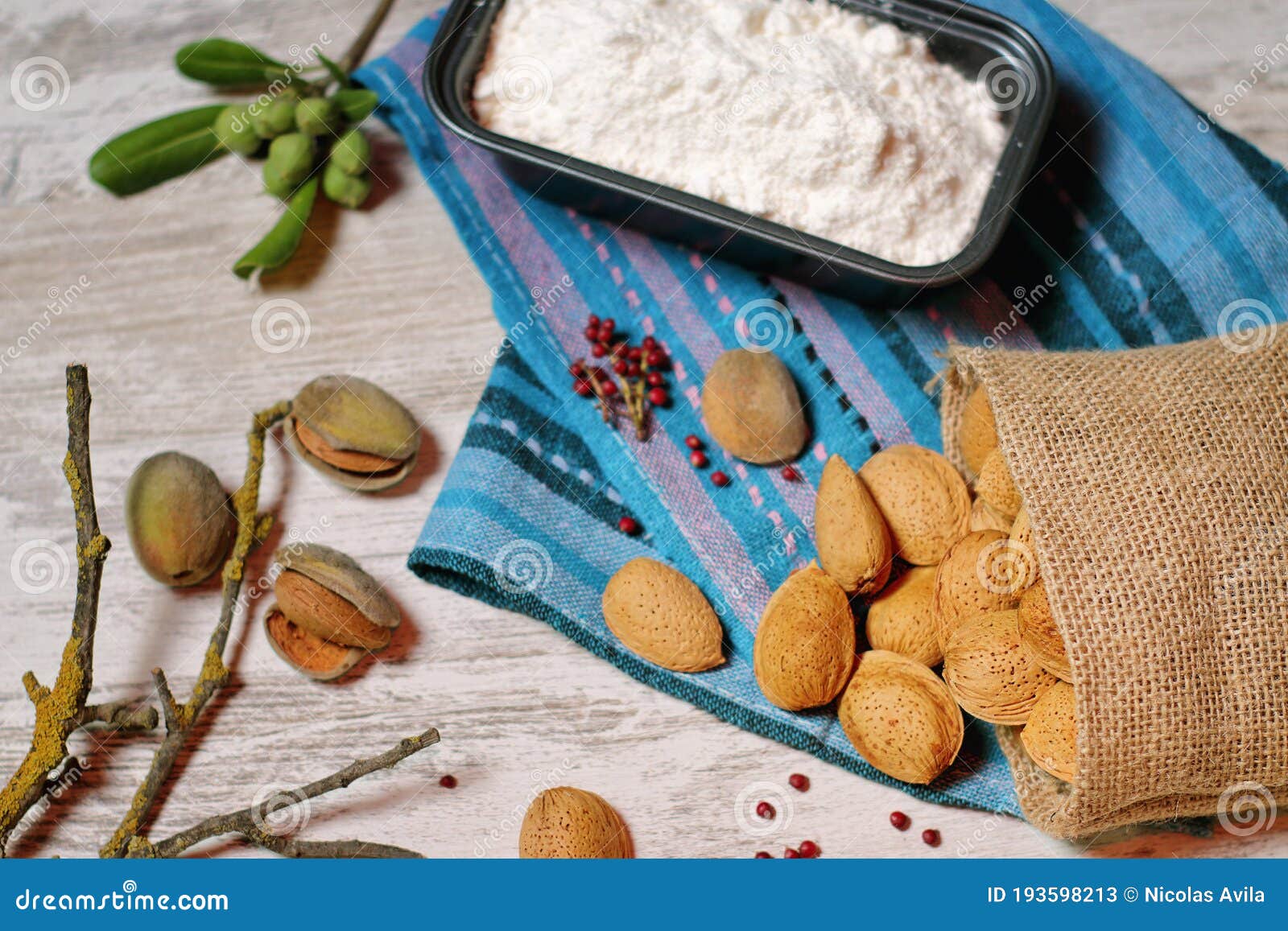 almonds in a cloth bag and container with flour ii