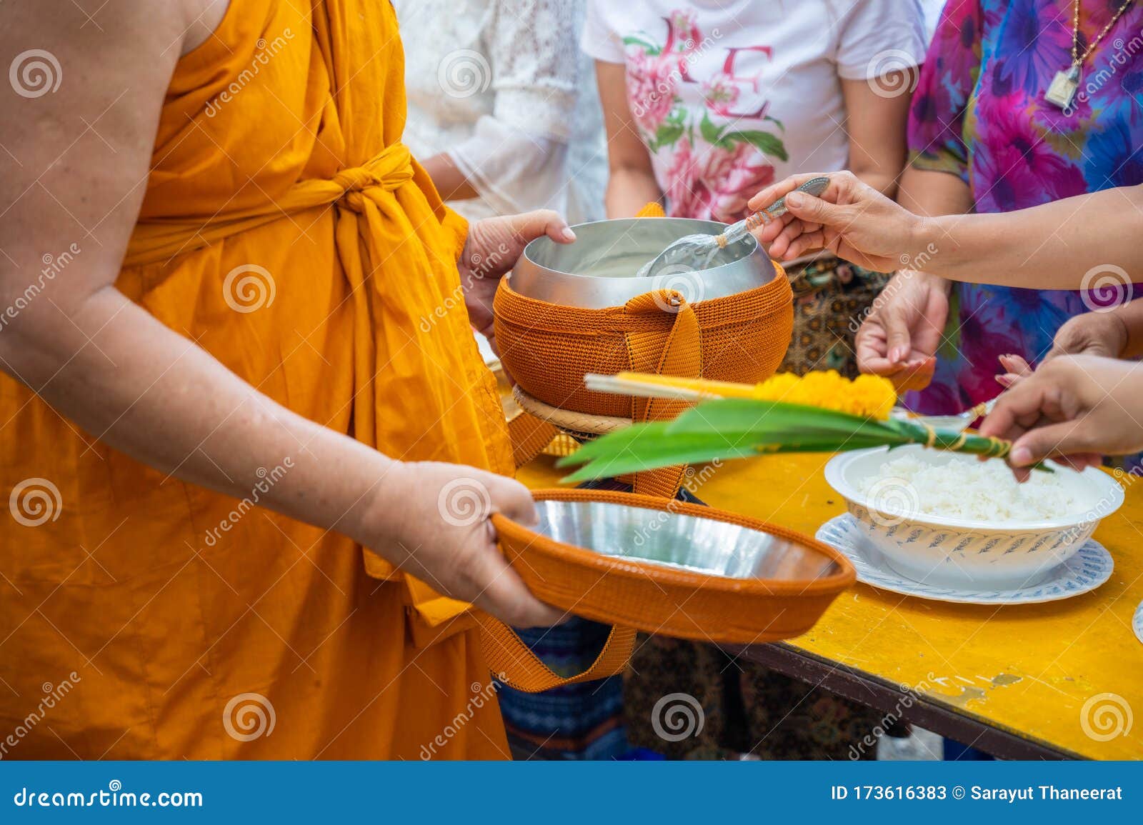alms round the yellow robes of monks walk on alms round as a buddhist activity