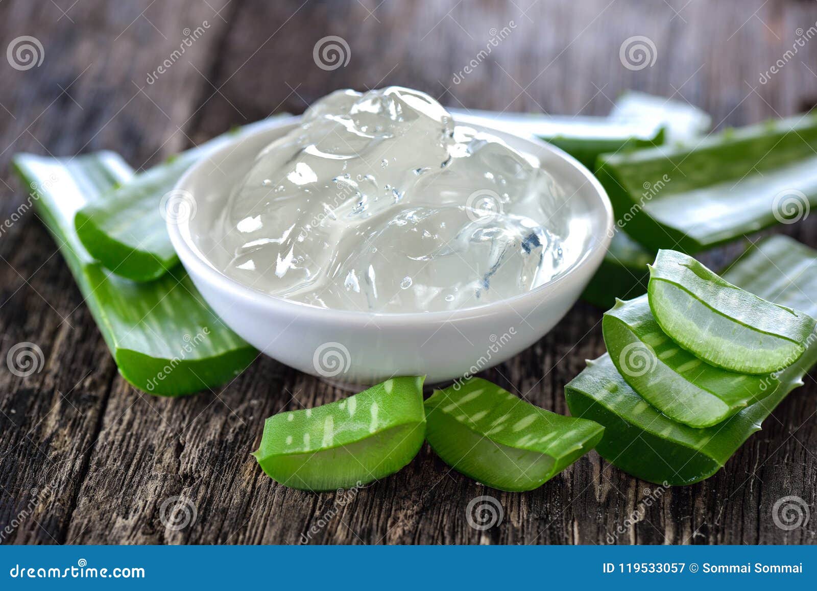 aloe vera gel in bowl with on wooden table
