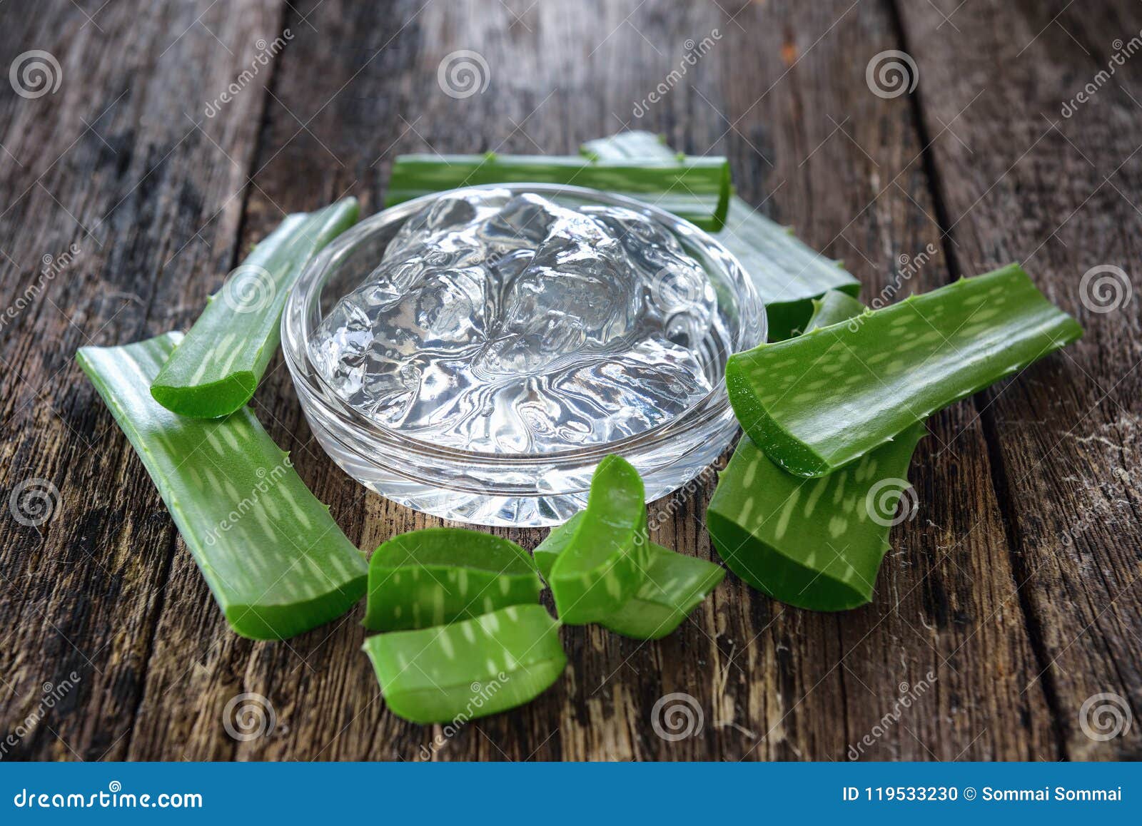 aloe vera gel in bowl with on wooden table