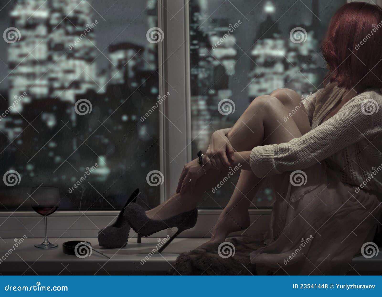 alone beautiful woman sitting on window