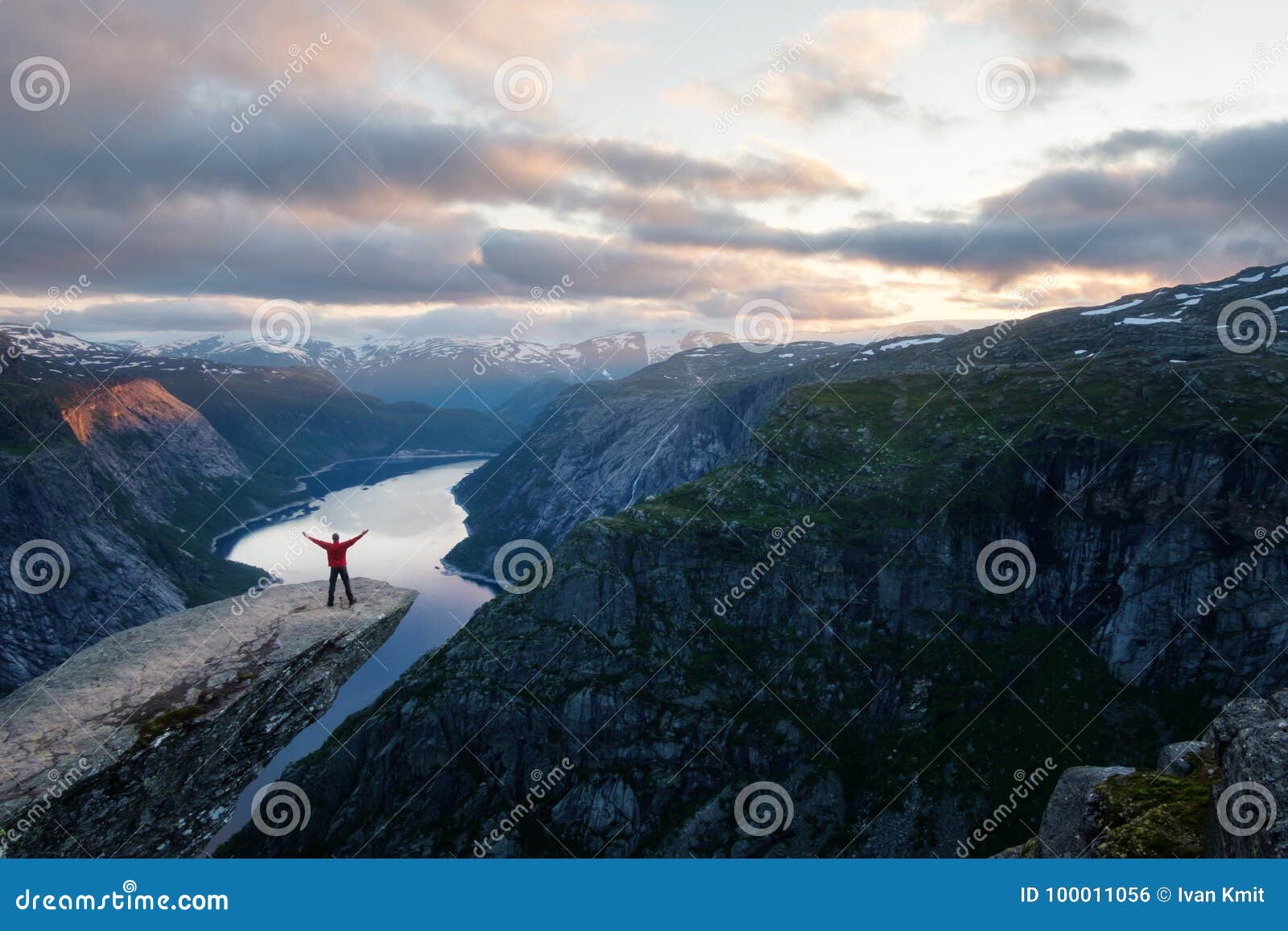 alone tourist on trolltunga rock