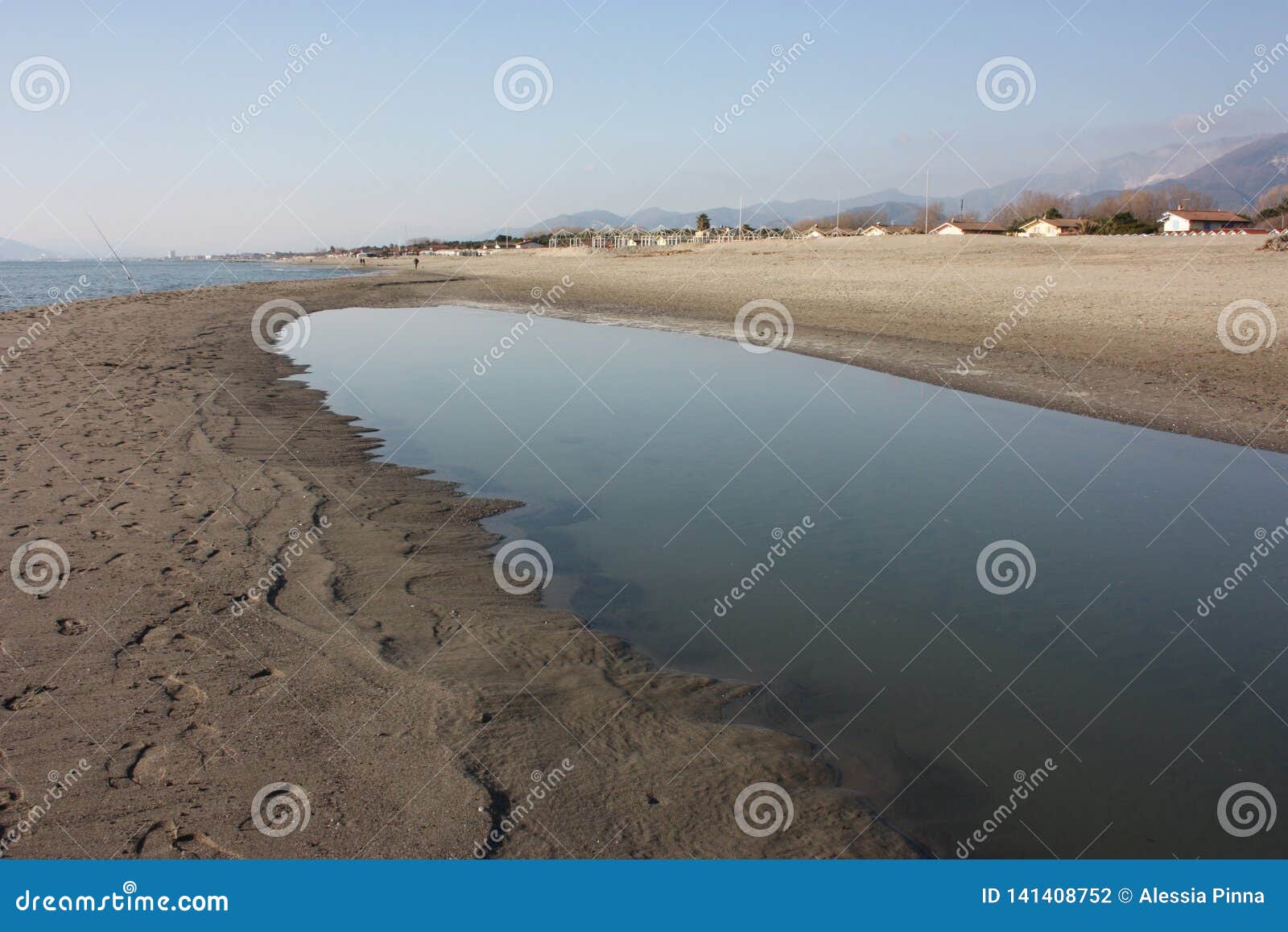 Along the Versilia Coast in Tuscany, on the Promenade Along the Sand, You  Often Meet Pools of Water after the Storm, Right in Stock Photo - Image of  europe, mountain: 141408752