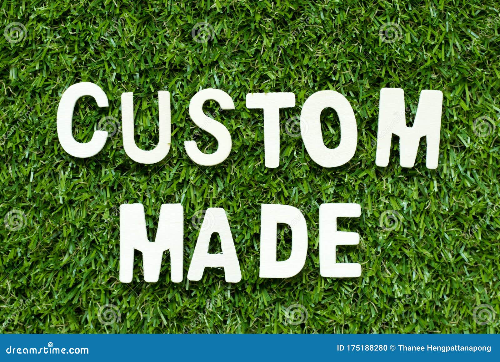 Alphabet Letter in Word Custom Made on Green Grass Background Stock