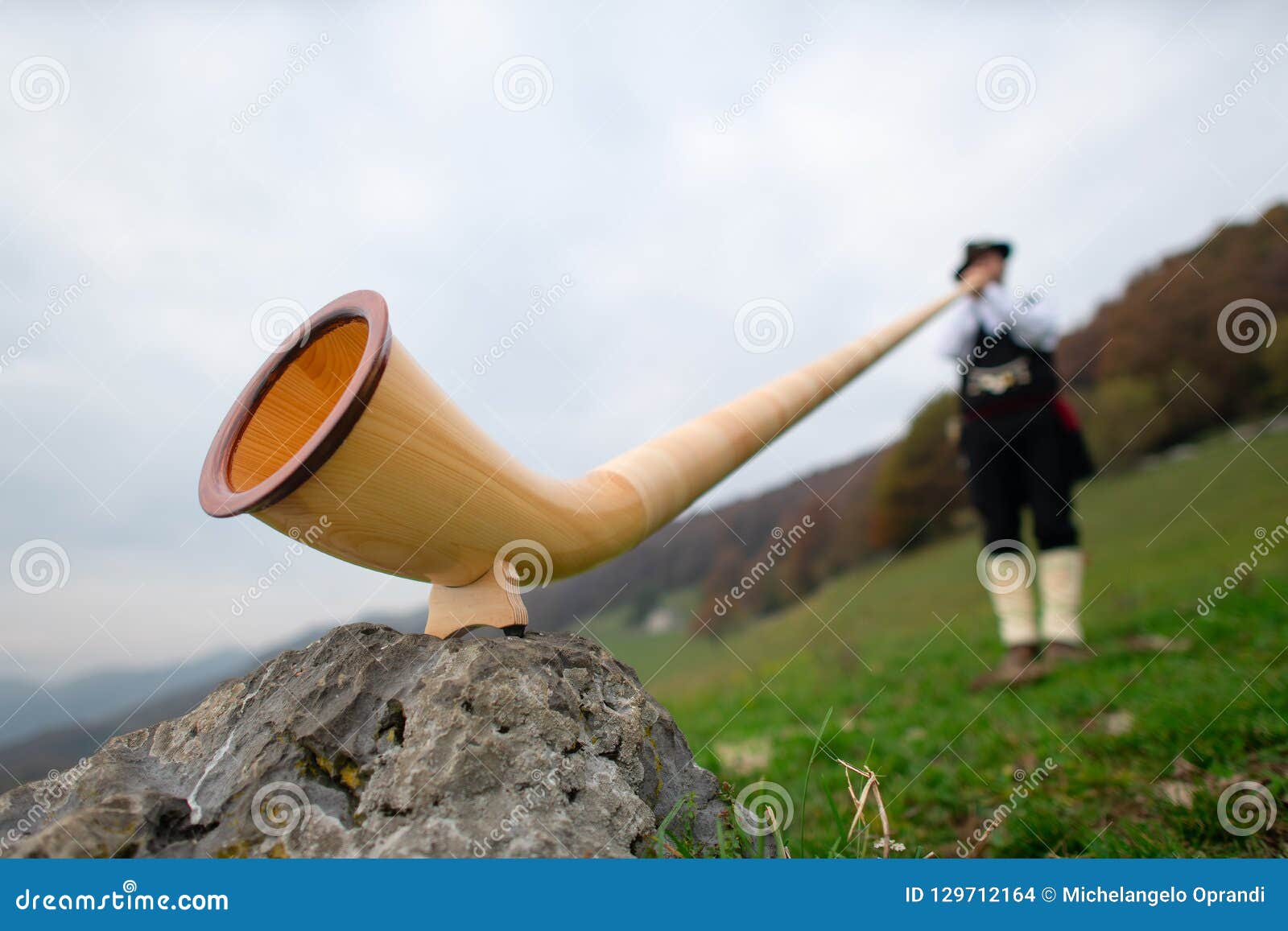 Alpine Horn. a Man Plays in an Alpine Valley Stock Photo Image of horns, tradition 129712164