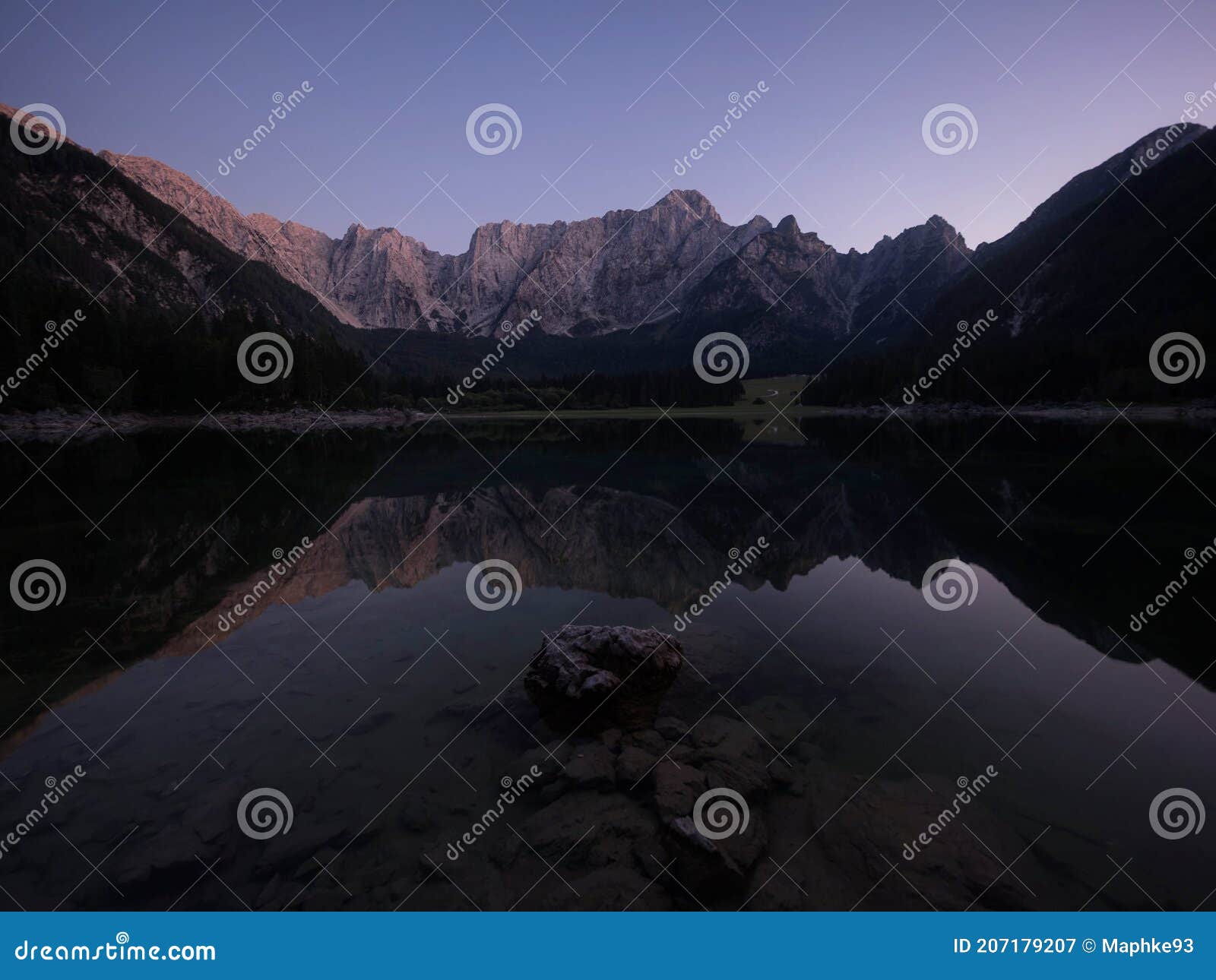 alpine mountain lake landscape panorama reflection at laghi di fusine weissenfelser see in tarvisio dolomites alps italy