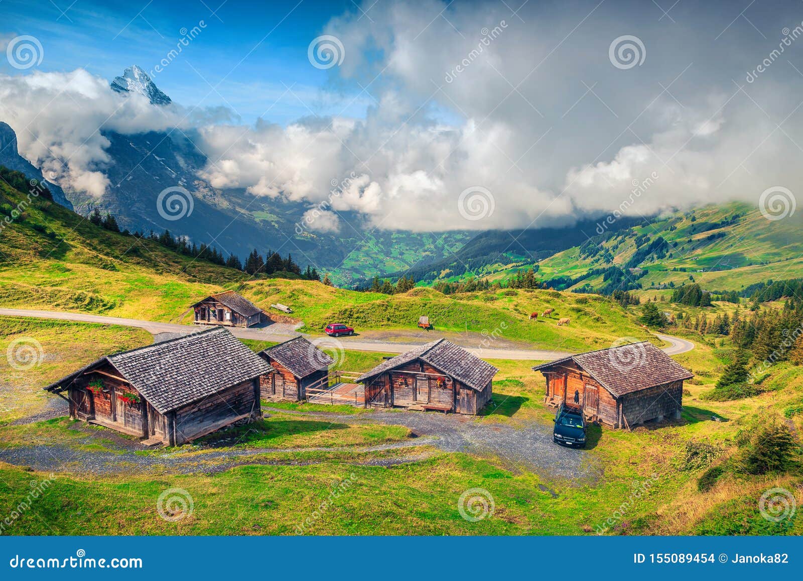 alpine wooden farmhouses and mountain farmland, grindelwald, bernese oberland, switzerland
