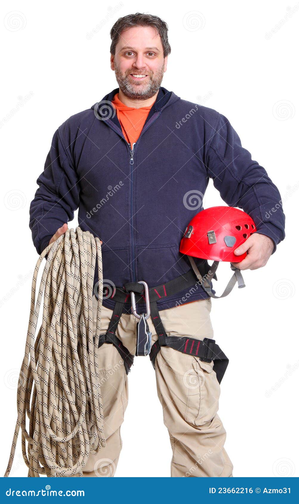 alpinist smiling with ropes and a helmet