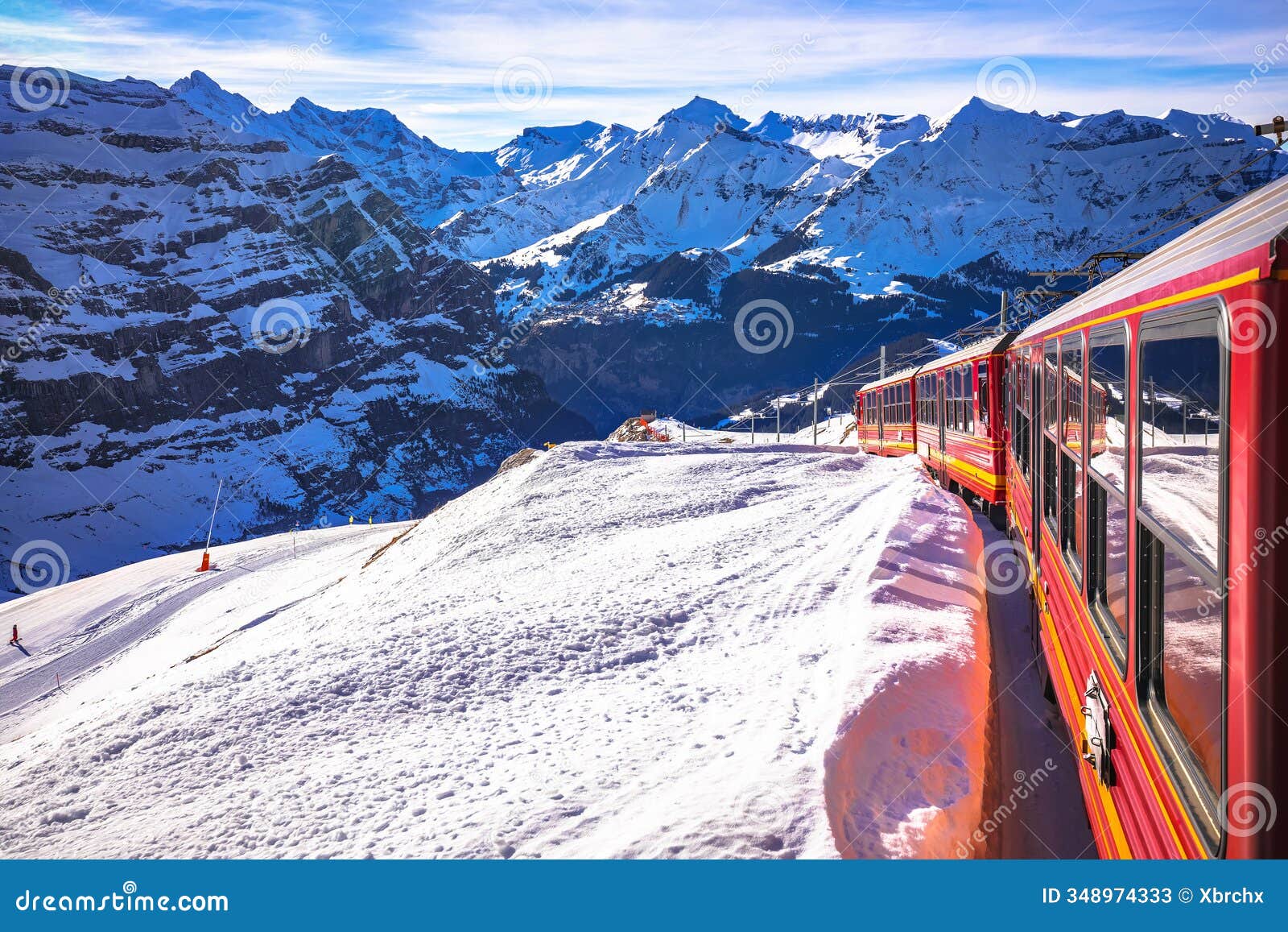 alps train descending down from jungfraujoch peak to wengen, idyllic alpine landscape