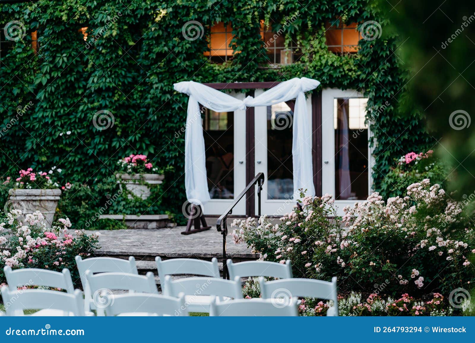 Altar before the Glass Doors and a Rows of Chairs Ready for a Wedding