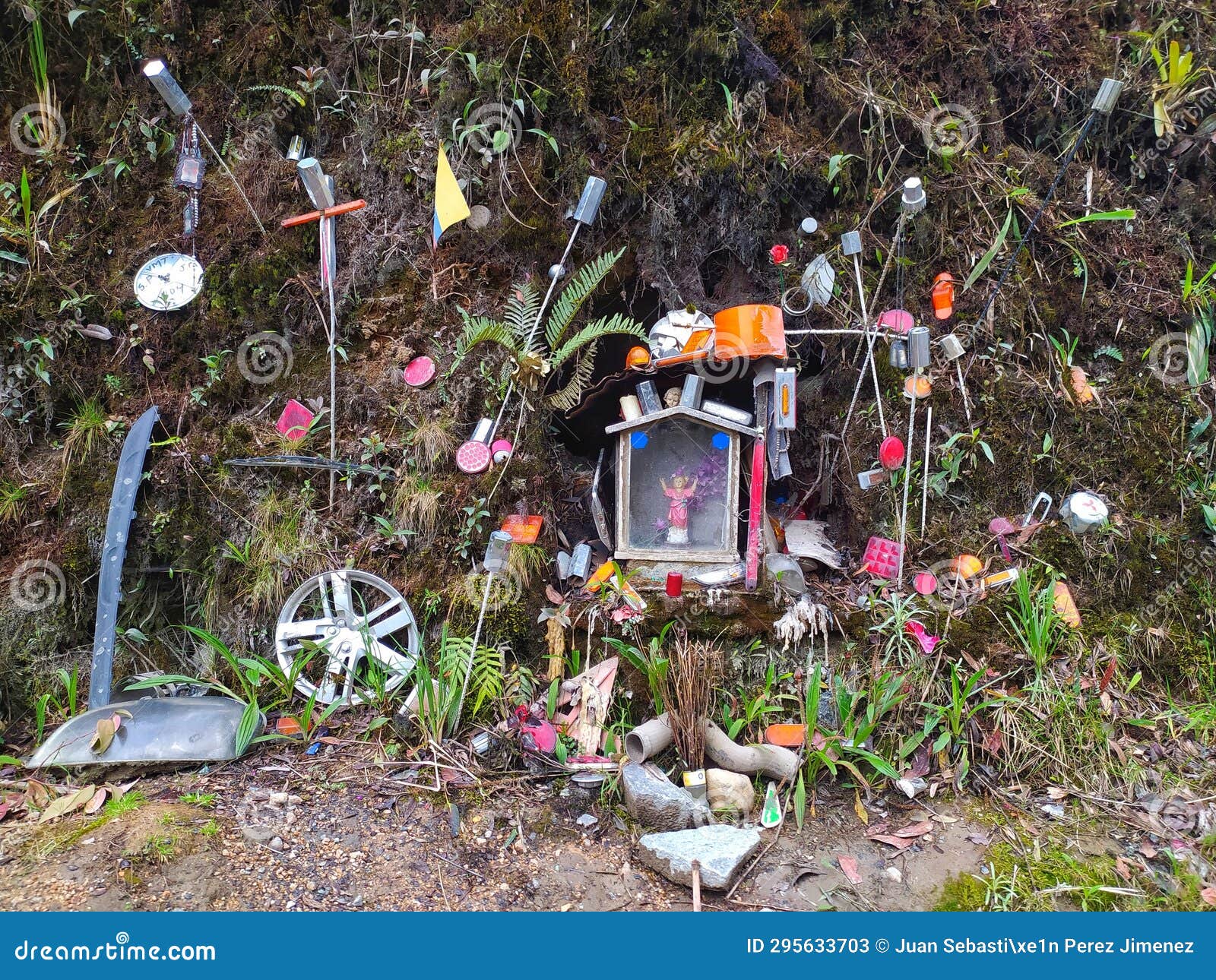 altar to the divino niÃ±o, including rims, mufflers, and other vehicle parts.