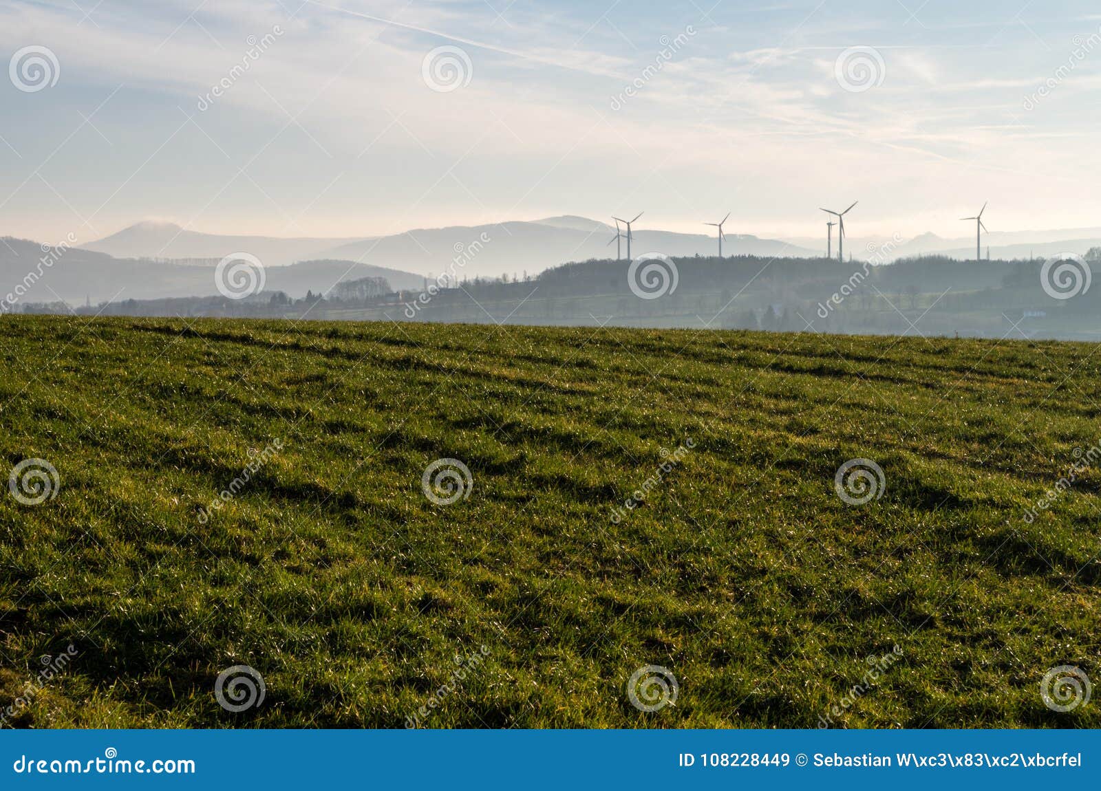 alternative energy resources for the future - windmills in the background