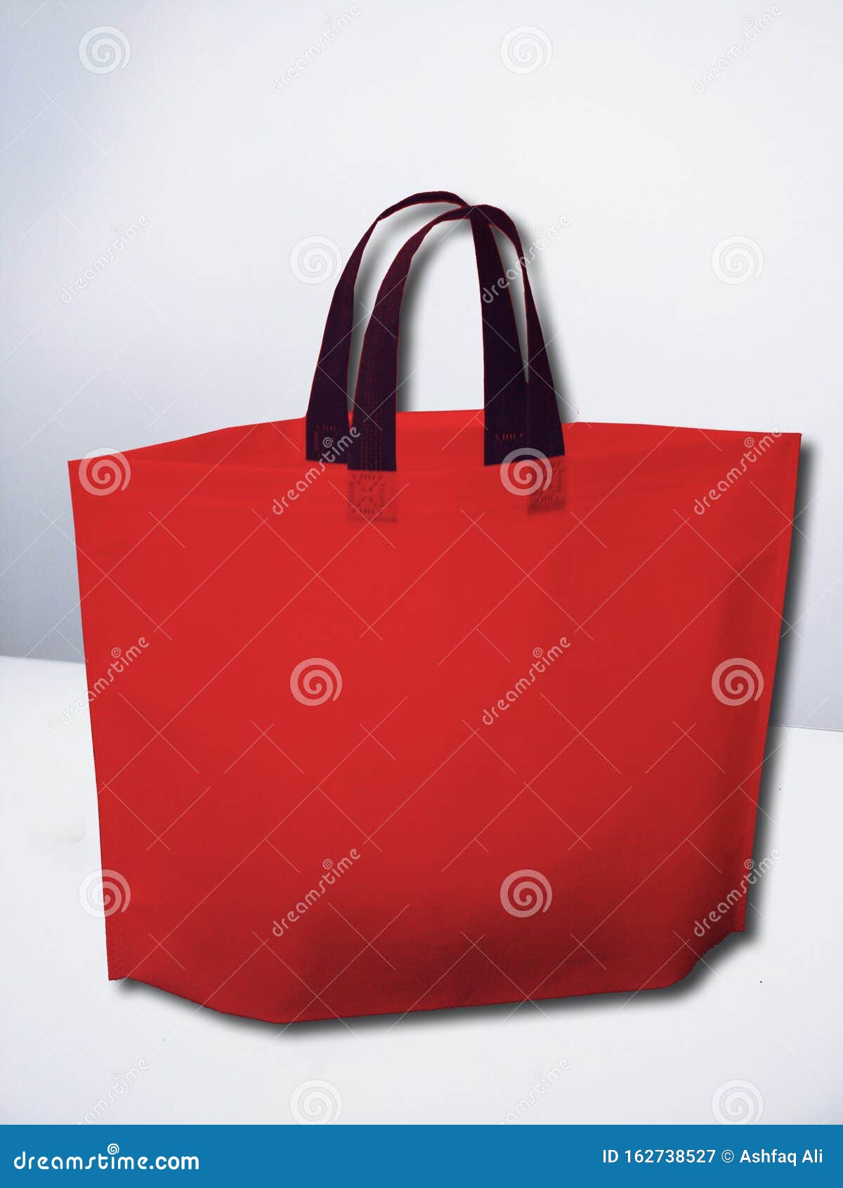 Alternative of Plastic Bags, Eco Friendly Non Woven Red Bag Stock Image