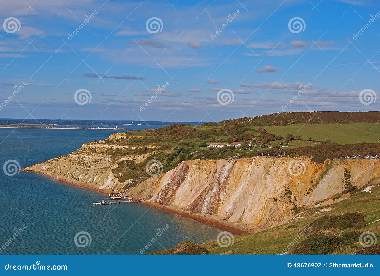 alum bay with her popular coloured sand with pier and chairlift station