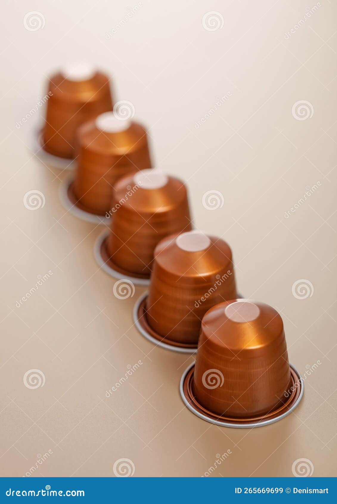 Aluminium Coffee Capsules Pods for Coffee Machine on Beige Background
