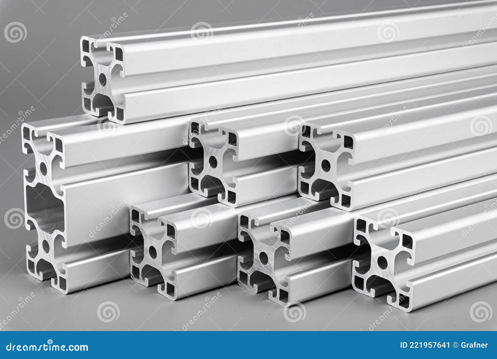 aluminum exstrusion profile bars gray background. metal construction industry engineering and material concept